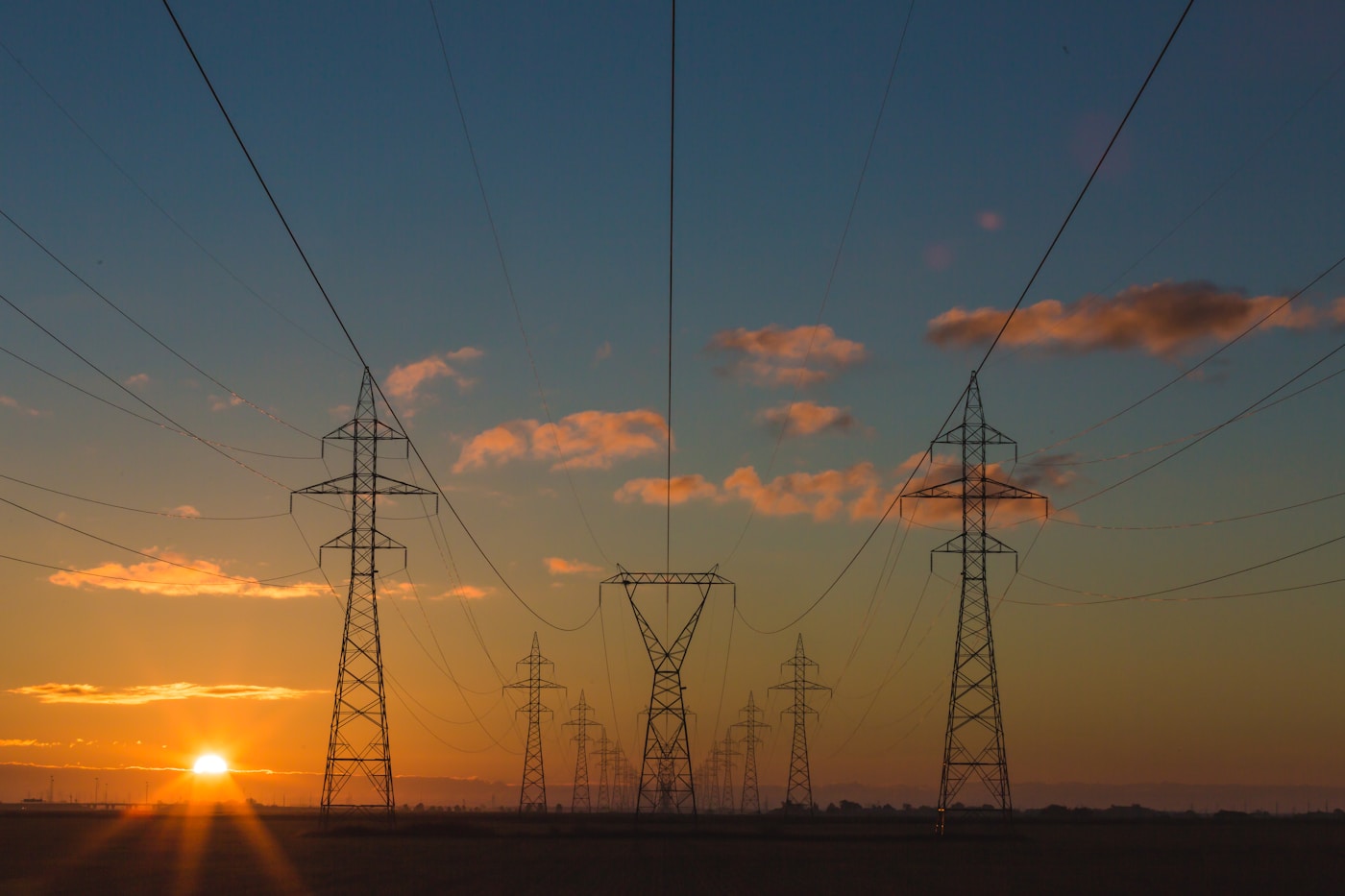 Power transmission towers at dusk